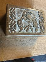 Top view showing carved dream catcher design and overall box shape