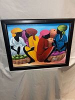 Front view of framed Haitian folk art painting