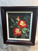 Front view of framed oil painting showing roses and frame