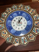 Front view of scalloped Khatam wall clock showing full design