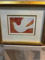 Front view of framed white dove lithograph showing entire artwork, mat and frame