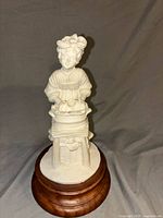 Full view of A. Bernini white sculpture on wooden base