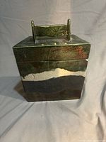 Front view of rectangular Raku pottery box with lid and handle