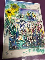 Front view of signed "Sunflower Cows" print with purple mat