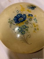 Top view showing floral hand-painting on alabaster lid