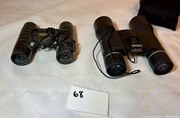 Both binoculars side by side with lot tag visible