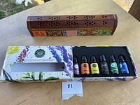 Closed incense holder and open Woolzies box with oils