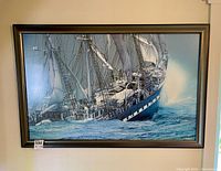 Full view of framed sailing ship print on wall