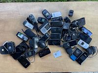 Overhead view of entire lot showing phones, cables, chargers and cases