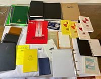 All notebooks spread on table