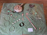 Full layout of all items on green cloth