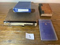 all four books arranged on table