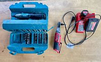 Full lot showing Makita screwdriver kit, Milwaukee ratchet, charger and battery