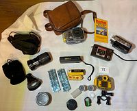 Group shot of all cameras, lenses, film and accessories laid out