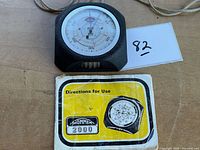 Front view of altimeter with instruction booklet