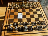 Full view of chess set on board showing both armies