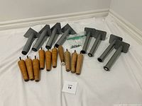 Group shot of metal and wooden legs with screws bag