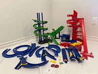 Full lot showing spiral towers, tracks, accessories, red car