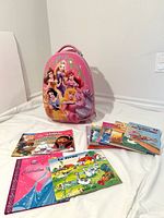 Suitcase with visible books spread and stack