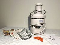 Full lot showing juicer, manuals, cleaning tool