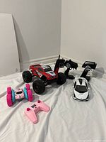 Three RC cars with controllers grouped together