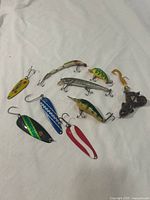 All nine lures arranged to show fronts and hooks