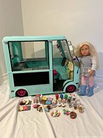 Full view of ice cream truck with doll and accessories spread