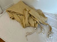 Full view of folded sun shade sail on surface