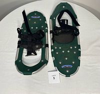 Top view showing both snowshoes, deck color, frame, bindings, branding