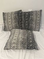 All three matching pillows upright showing front pattern