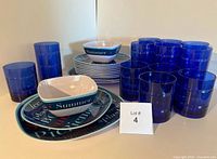Full lot showing tumblers, plates, bowls, serving plate
