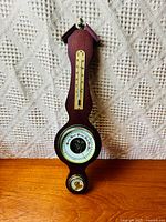 Front view of the vintage 3-in-1 mahogany weather station showing all three instruments: thermometer, barometer, hygrometer.