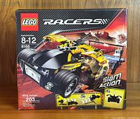 Front of new and unopened LEGO Racers Wing Jumper set 8166 box showing car model, age information, and piece count.