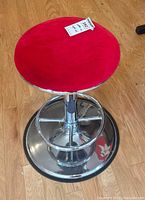 Top view showing red fabric seat and chrome base