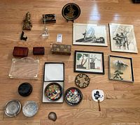 Overview of entire lot showing plates, boxes, sculpture, framed artworks and small accessories