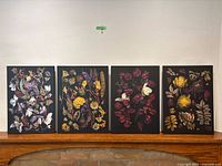 All four floral prints lined up on mantel
