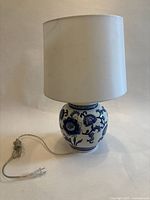Full view of lamp showing ceramic base, shade, and cord