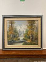 Full view of framed landscape painting