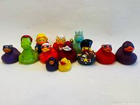 Group shot showing all twelve novelty rubber ducks