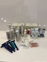 Group shot of all toiletries, razors, Omorovicza boxes, soap, cotton pads