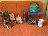 Overall view of all lunch items arranged on couch