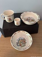 All four Bunnykins pieces grouped: mug, egg cup, rimmed bowl, shallow bowl