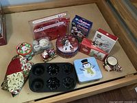 All items laid out showing variety of Christmas decor and bakeware
