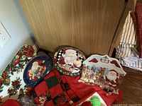 Plates, tray, runner and potholder on floor