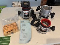 Overview of router motor, three bases, bit set, manuals and guide