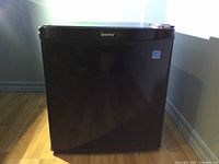 Front view of black Danby mini fridge