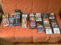 Overview of DVDs and CDs arranged on couch