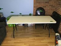 Full view of rectangular folding table set up on floor