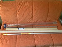 All long items laid out on couch