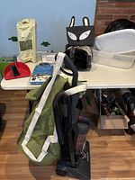 Group shot showing vacuum, green laundry bag, pet cube, storage bins